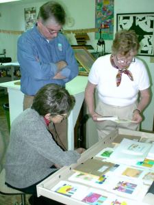 Jan Griffin (R) shows her "Interior Landscape" silk screened prints to Alice Steer Wilson and Paul Stridick, 2001.